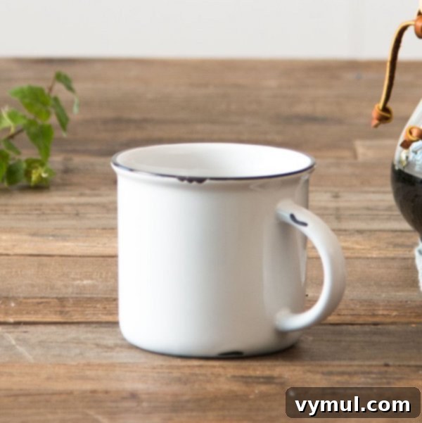 Good Things 8 Your Guide to Gardens Wellness Fall Fashion and Must Reads 4 Magnolia stoneware mugs with a tinware-like black and white design.