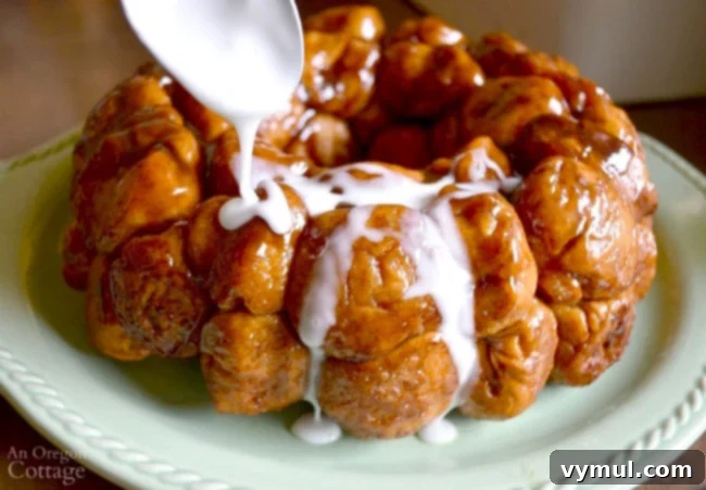 A golden, sweet make-ahead monkey bread, adorned with a glaze, showcasing a delightful egg-free treat for special occasions.