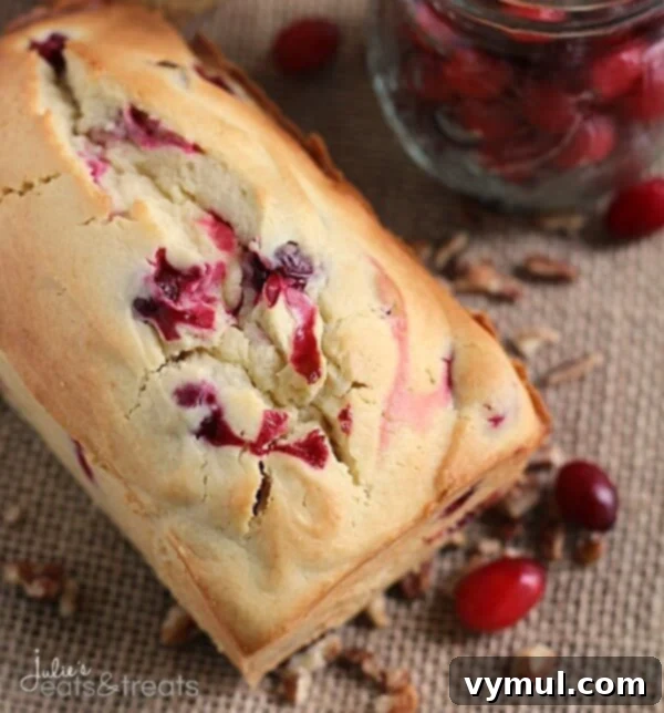 The Complete Collection of 17 Cranberry Bread Recipes Yeast Gluten-Free and Paleo 7 Cranberry Bread Recipes-Cream Cheese Cranberry Bread, highlighting its rich and moist texture.