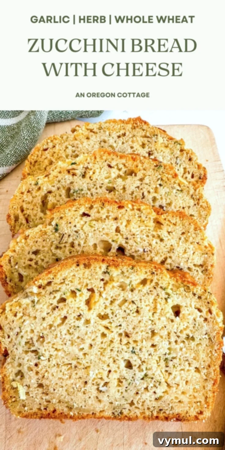 A beautifully baked savory zucchini bread with cheese, perfect for a Pinterest share, highlighting its golden crust and savory appeal.
