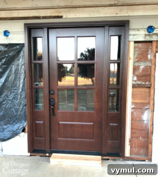 Farmhouse Fixer: One Year In – A Complete Review and Video Tour 7 Farmhouse fixer wood door installed