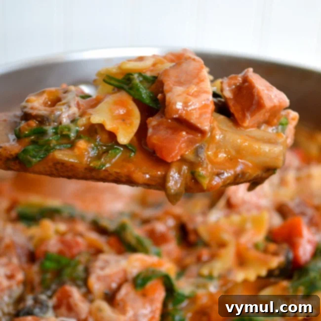 Sixty Plus Fast Healthy Recipes for Simple Meal Prep 15 A steaming pot of One Pot Italian Pasta with Sausage & Spinach, a delicious and easy weeknight meal.