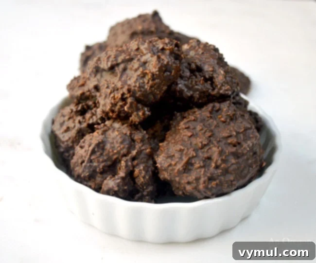 Sixty Plus Fast Healthy Recipes for Simple Meal Prep 16 A tempting pile of Low Sugar Dark Chocolate Coconut Clusters, a quick and healthy dessert option.