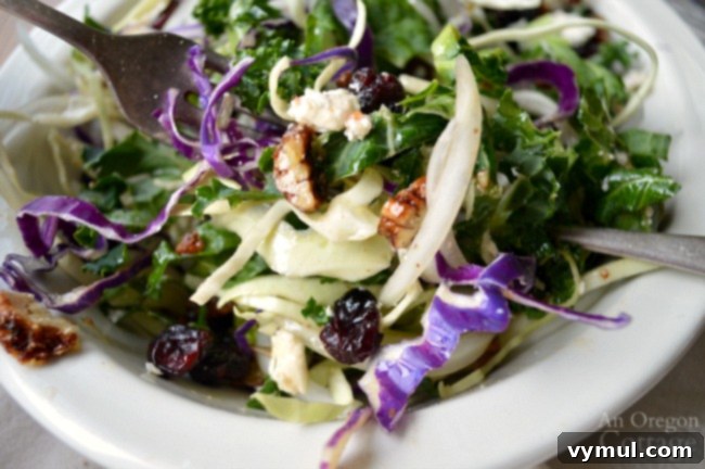 Fresh Kale Cranberry Salad with Feta and Pecans served in a bowl