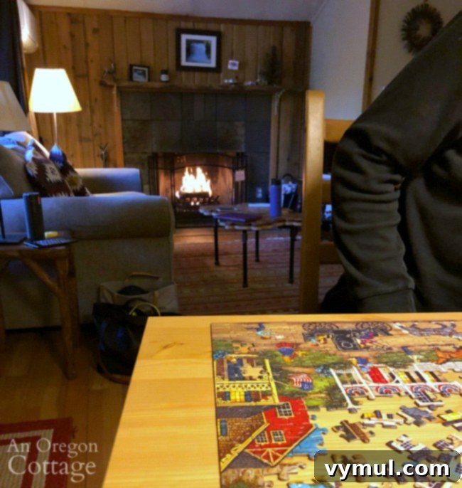 Episode 53 Finding Joy Through Gratitude Life Updates and Comfort Food Deep Dive 7 A person working on a jigsaw puzzle inside a cozy, rustic cabin, depicting a peaceful and engaging mid-winter activity