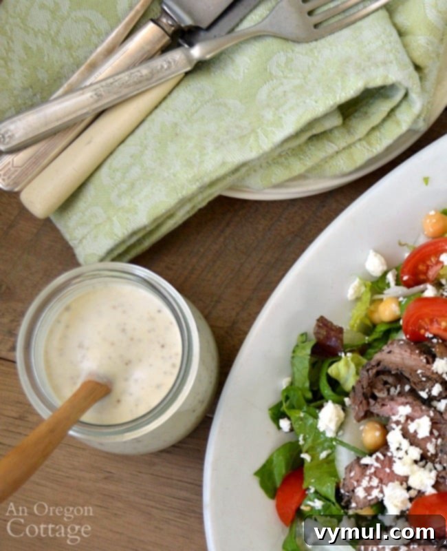 Velvety Garlic Pepper Dressing 3 Creamy Garlic Pepper Salad Dressing poured over salad