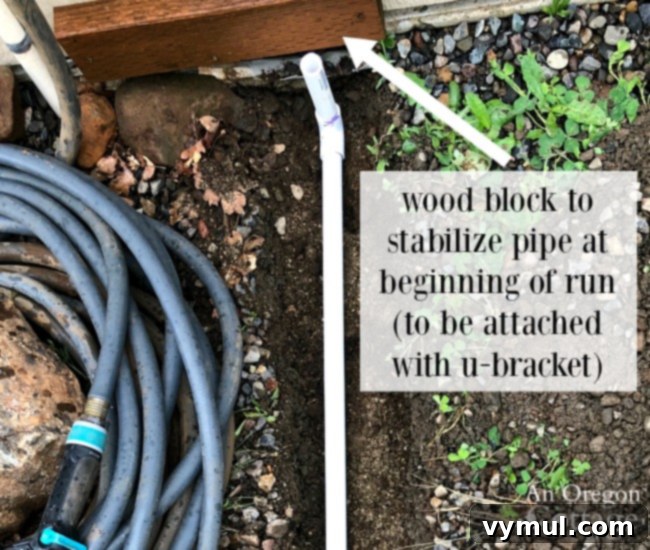 Budget Garden Watering Made Easy 7 Wood block at beginning of water system