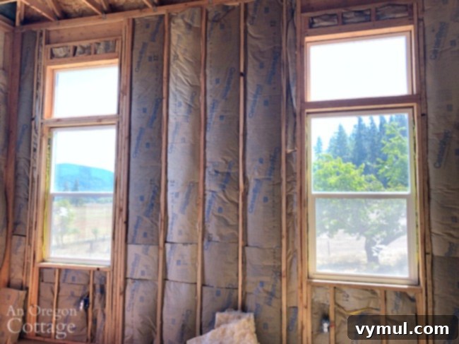 Insulated walls in a bedroom during farmhouse remodel