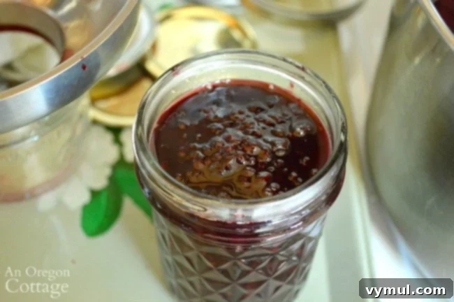 Filling jars with Maple Blackberry Jam