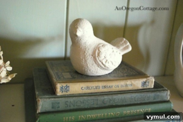 Painted white dove figurine styled on vintage books