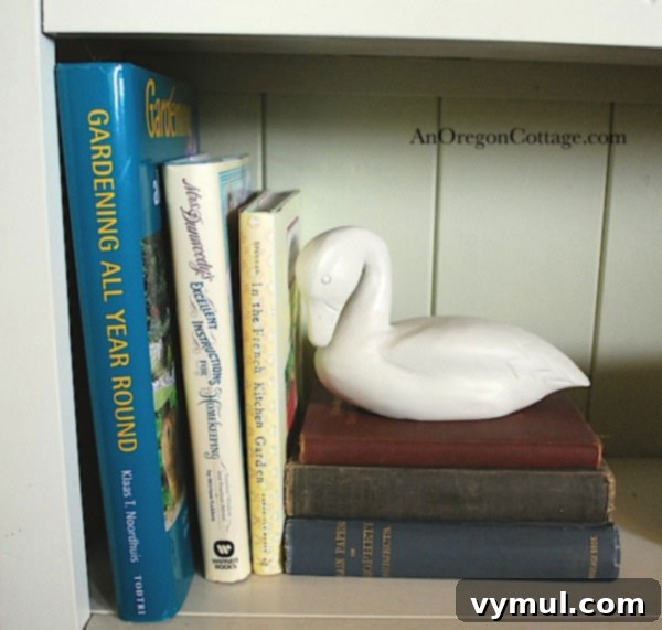 White painted duck figurine as a bookend