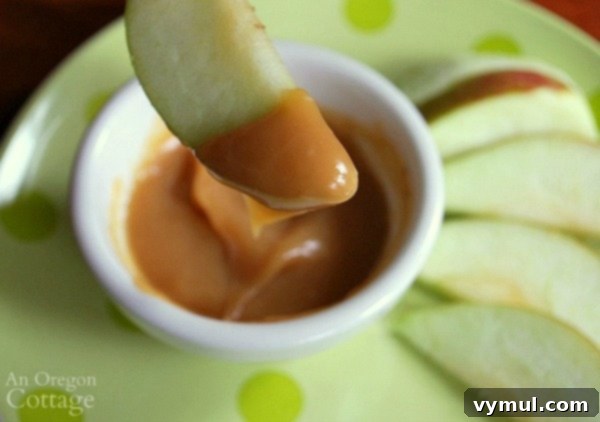 Homemade caramel dip on apple slice