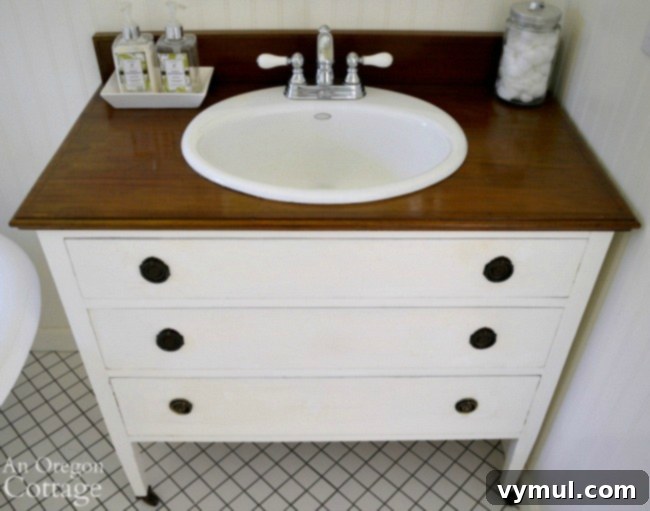 An elegant dresser transformed into a functional bathroom vanity, viewed from above, showcasing the DIY conversion.
