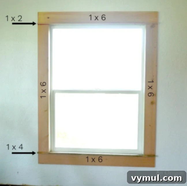 Close-up of a window showcasing robust wood trim, ready for a DIY farmhouse style transformation.