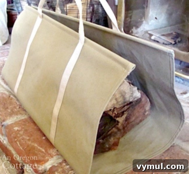 A sturdy canvas log carrier resting on a cozy hearth, ready for transporting firewood.