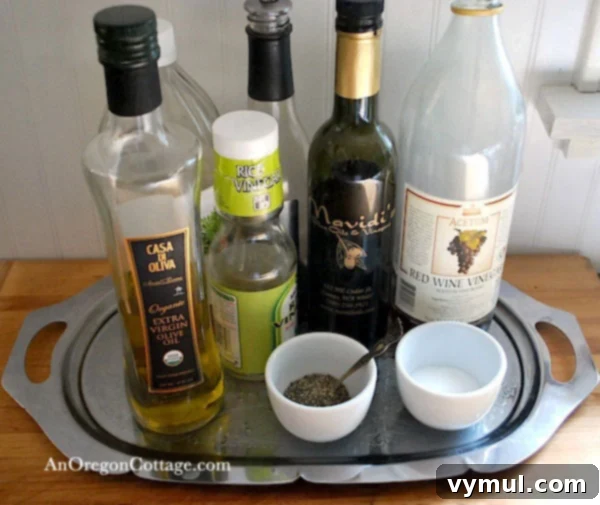 Stainless steel tray holding oil, vinegar, and spices next to a stove