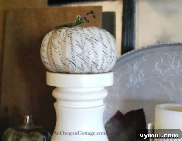 script decoupage pumpkin Close-up of a DIY scripted decoupage pumpkin, showcasing vintage appeal