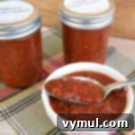 Simple Secrets to Perfectly Trellised Tomatoes 11 Jar of Addictive Tomato Chutney on a wooden surface