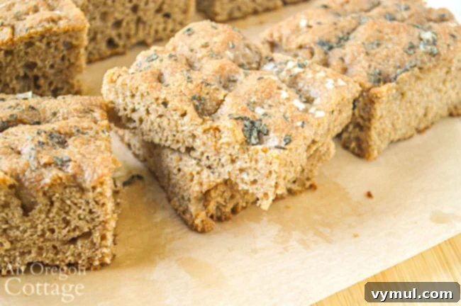 Freshly baked sourdough focaccia bread sliced into perfect burger and sandwich buns