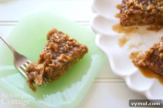 Someone enjoying a piece of sticky bun sourdough coffee cake with a fork.