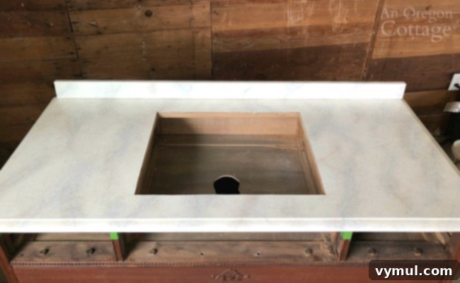 Episode 5: Garden Bed Soaker Hose Setup and DIY Rustic Metal Table 7 Painted dresser being transformed into a faux marble vanity for the bathroom.