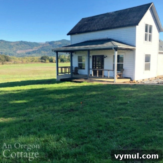 Expansive farmhouse with a lush green lawn, embodying the dream of country living.