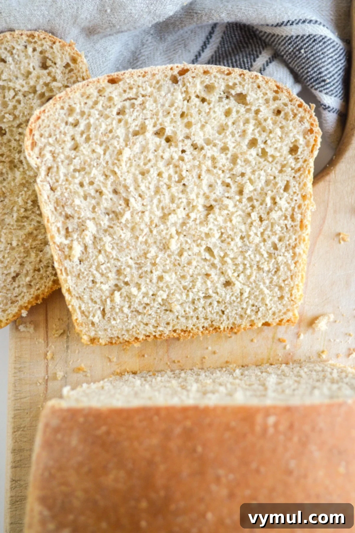 sliced sourdough sandwich bread on cutting board