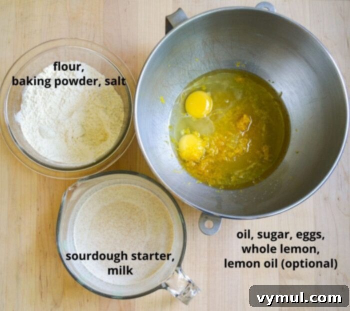 Bright Lemon Sourdough Loaf from Discard 4 Various ingredients for sourdough lemon bread laid out on a surface.