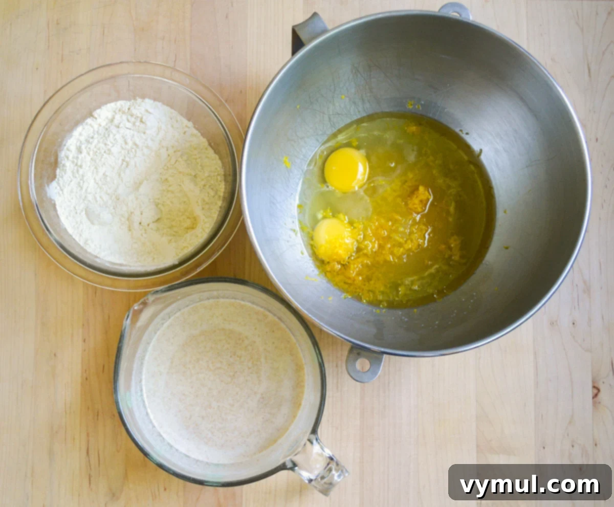 Bright Lemon Sourdough Loaf from Discard 5 Mixing sourdough lemon bread batter in a large bowl.