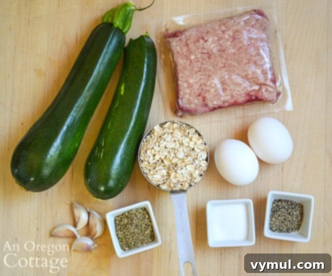All the fresh ingredients for making wholesome zucchini meatballs laid out on a kitchen counter: grated zucchini, ground meat, eggs, oats, garlic, and seasonings.