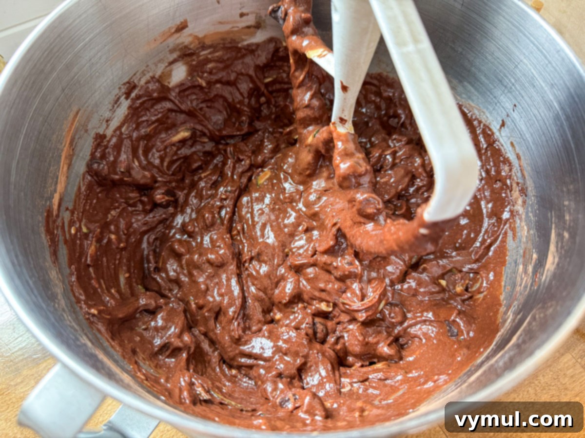 Secretly Healthy Chocolate Zucchini Cupcakes 3 Mixing the wet ingredients for chocolate cupcakes with zucchini