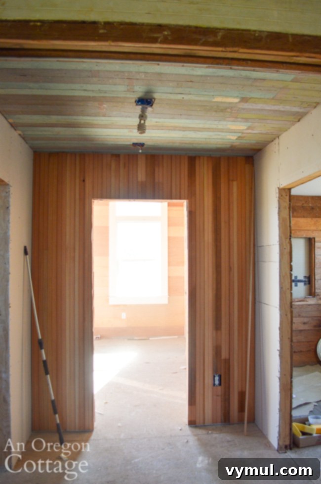 Mid-Year 3 Farmhouse Progress Tour 8 partial wood hallway walls