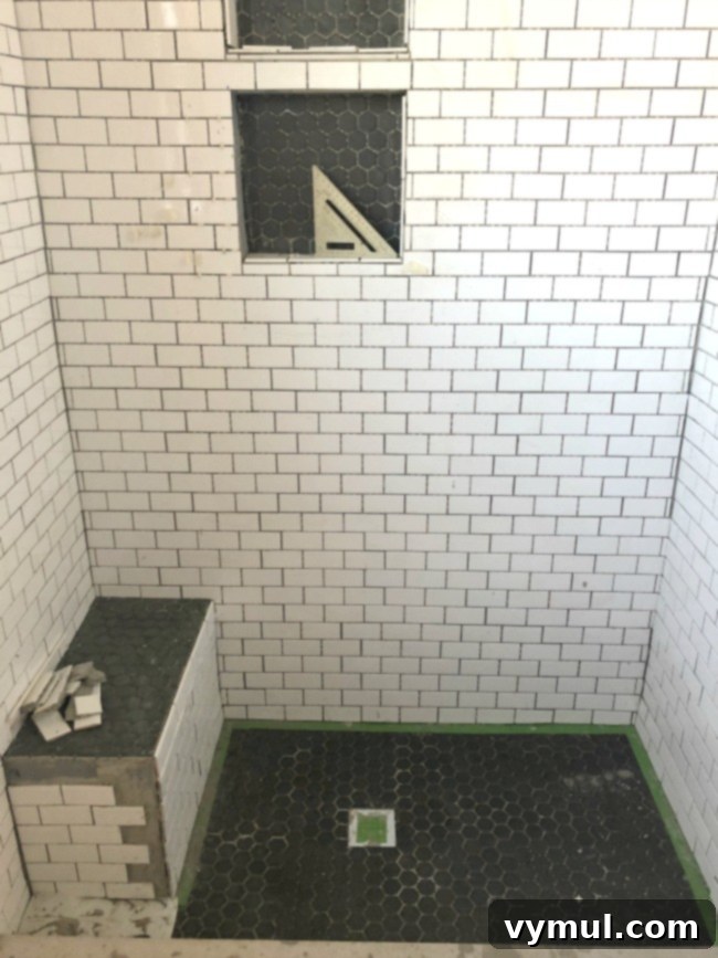 Our Farmhouse Main Bathroom Remodel Journey 7 shower tile in progress-floor