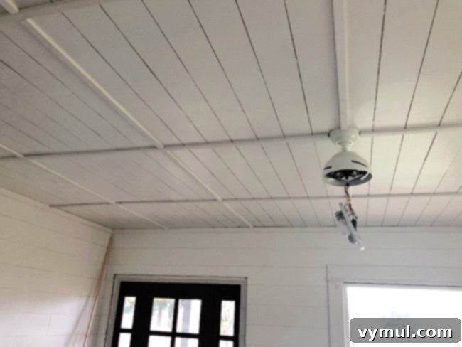 Good Things 33 featuring Best of 2020 3 finished living room ceiling: A beautifully updated farmhouse living room ceiling featuring a simple, minimal coffered pattern that adds rustic charm and character to the space.