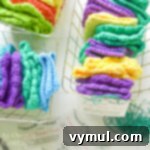 A stylish basket showcasing vibrant crochet unpaper towels, perfect for an eco-friendly gift.