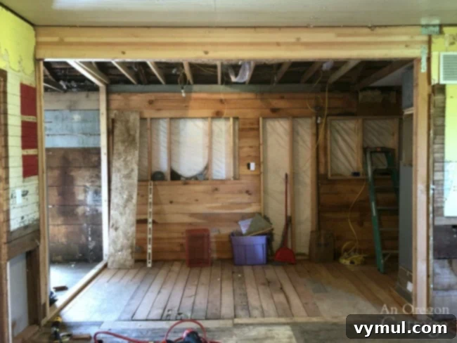 Farmhouse kitchen beam installed after wall removal
