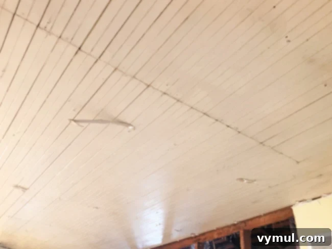 Original farmhouse beadboard kitchen ceiling discovered