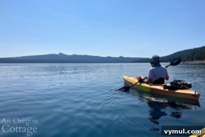 My Current Joys: Crescent Lake, Family Moments, Preserving the Harvest, Simple Dog Treats, and Favorite Entertainment 3 Kayaking on Crescent Lake with scenic mountain backdrop