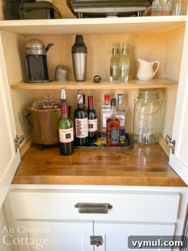 Joyful Roundup No. 39: Family Fun, Summer Heat, and Everyday Wonders 5 A stylish drinks cabinet, well-stocked with various liquors, sodas, and cocktail ingredients, ready for a family happy hour.
