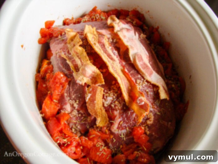 Rustic Italian Slow Cooker Pot Roast 3 roast, bacon, and tomatoes in slow cooker