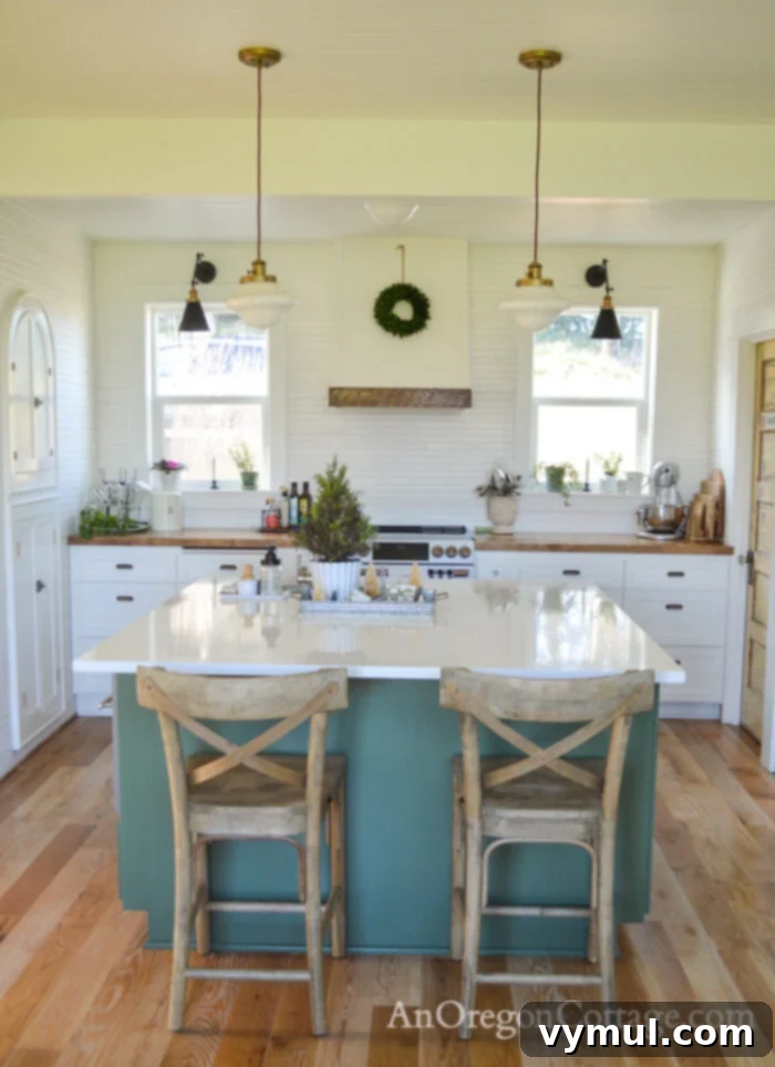 Renovated 1900 farmhouse kitchen at Christmas with new DIY stove hood and island decor