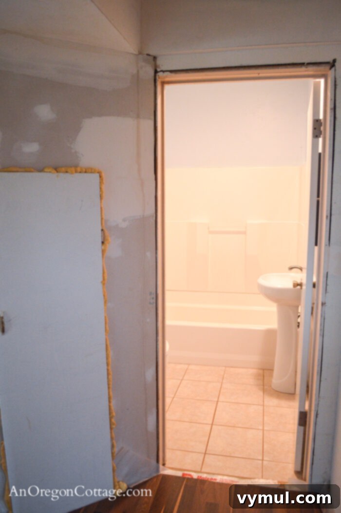 1900 Farmhouse Main Bathroom: Classic Charm Reimagined 9 Farmhouse master bath BEFORE-from hallway