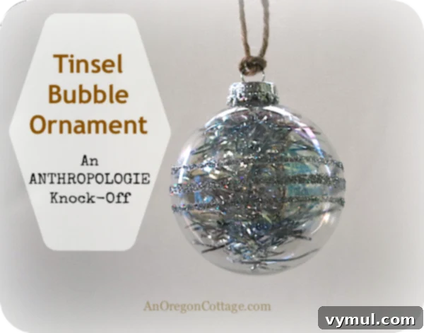 Tinsel-bubble-ornament Shiny tinsel and glitter bubble ornament hanging gracefully