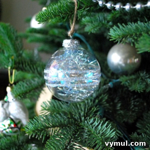 anthro-ornament-on-tree Finished Anthropologie-inspired tinsel ornament hanging on a Christmas tree