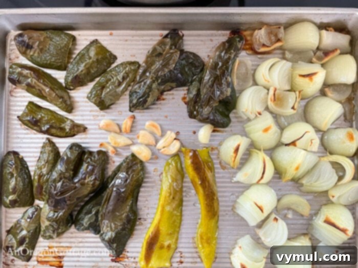 Thick Smoky Roasted Chipotle Salsa 4 roasted peppers-onions-garlic on baking sheet