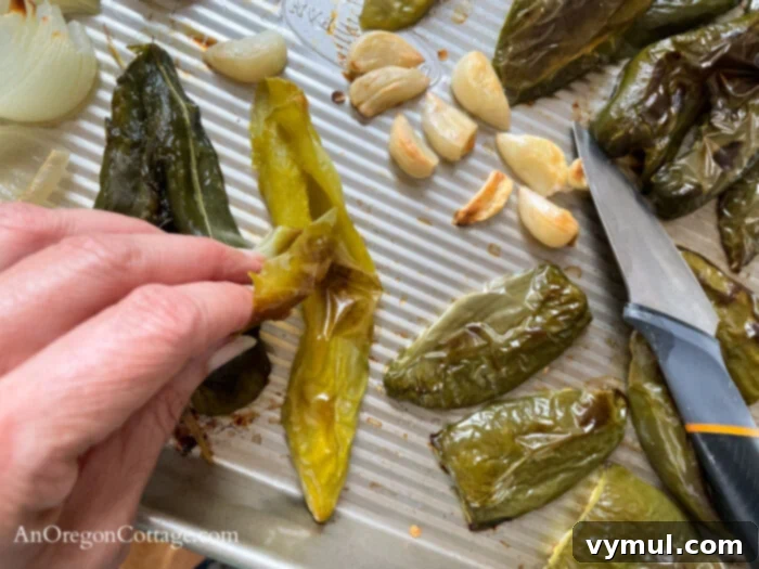 Thick Smoky Roasted Chipotle Salsa 8 peeling skin of roasted peppers