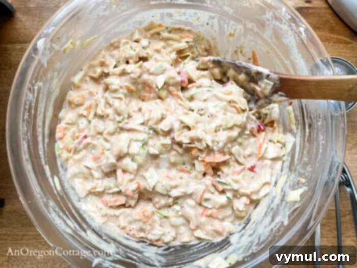 Speedy Sourdough Discard Veggie Fritters 6 Mixing sourdough vegetable fritter batter in a bowl