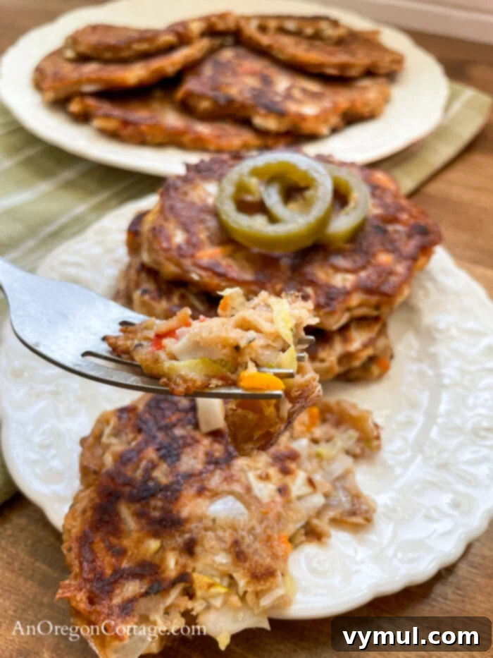 Speedy Sourdough Discard Veggie Fritters 8 Sourdough vegetable fritter on a fork, ready to eat