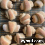 A small, mouth-watering image of golden-brown whole wheat crescent rolls.