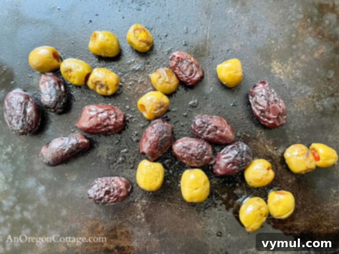 Velvety Roasted Olive Spread 5 roasted olives on baking sheet